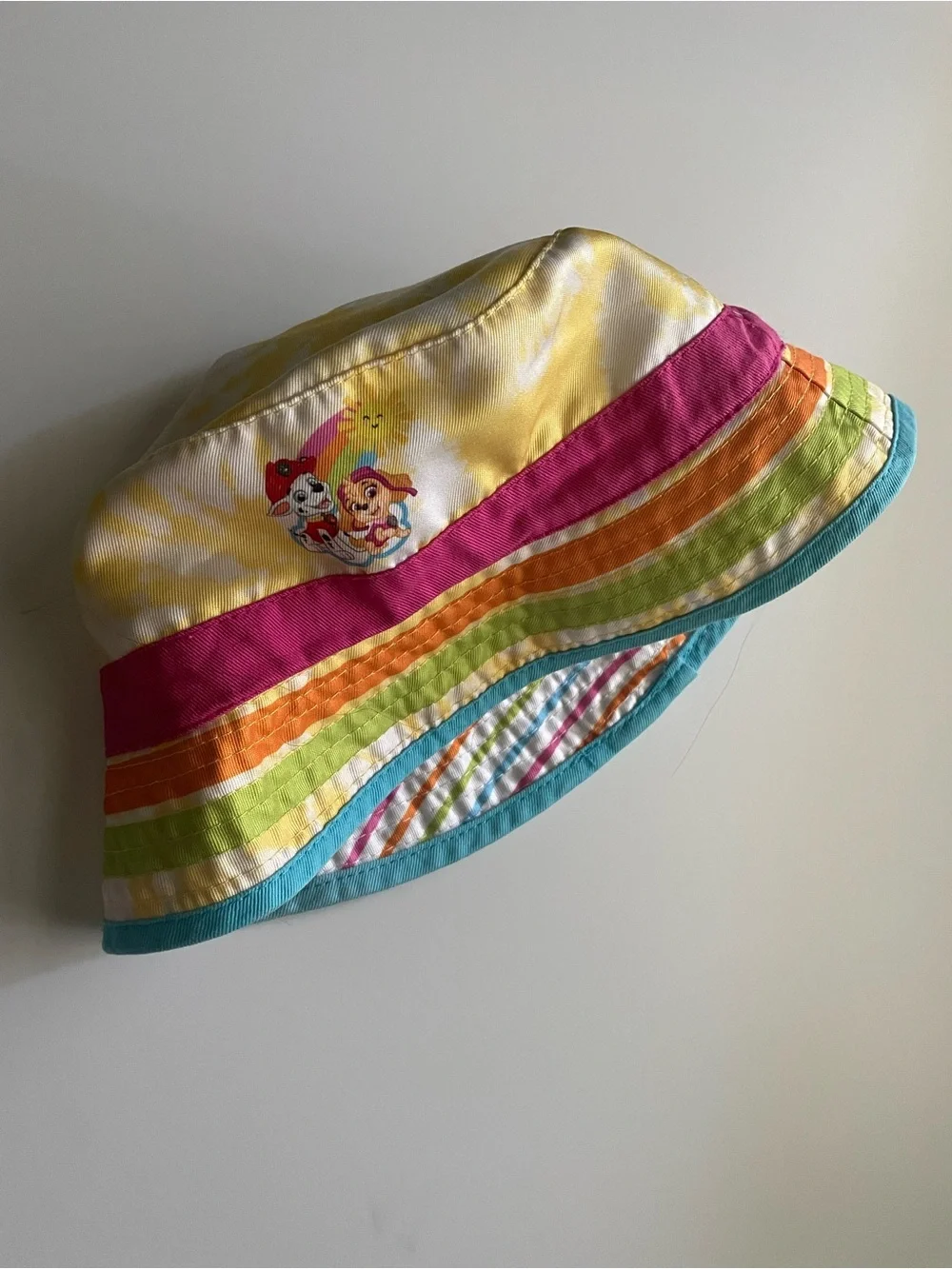 Paw Patrol Rainbow Stripe Reversible Bucket Hat in Yellow, Pink, Orange & Blue